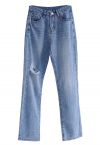 Hoch taillierte Jeans mit zerrissenen Details