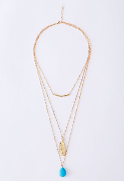 Mehrschichtige Halskette mit Türkisfederanhänger in Gold
