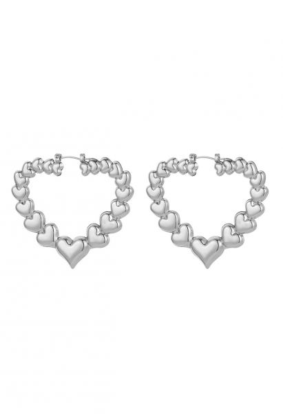 Ausgehöhlte Herz-Ohrringe aus Metall in Silber