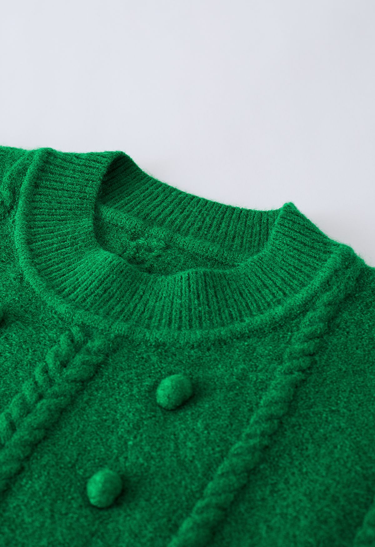Zopfmuster-Pullover mit Pom-Pom-Besatz in Grün