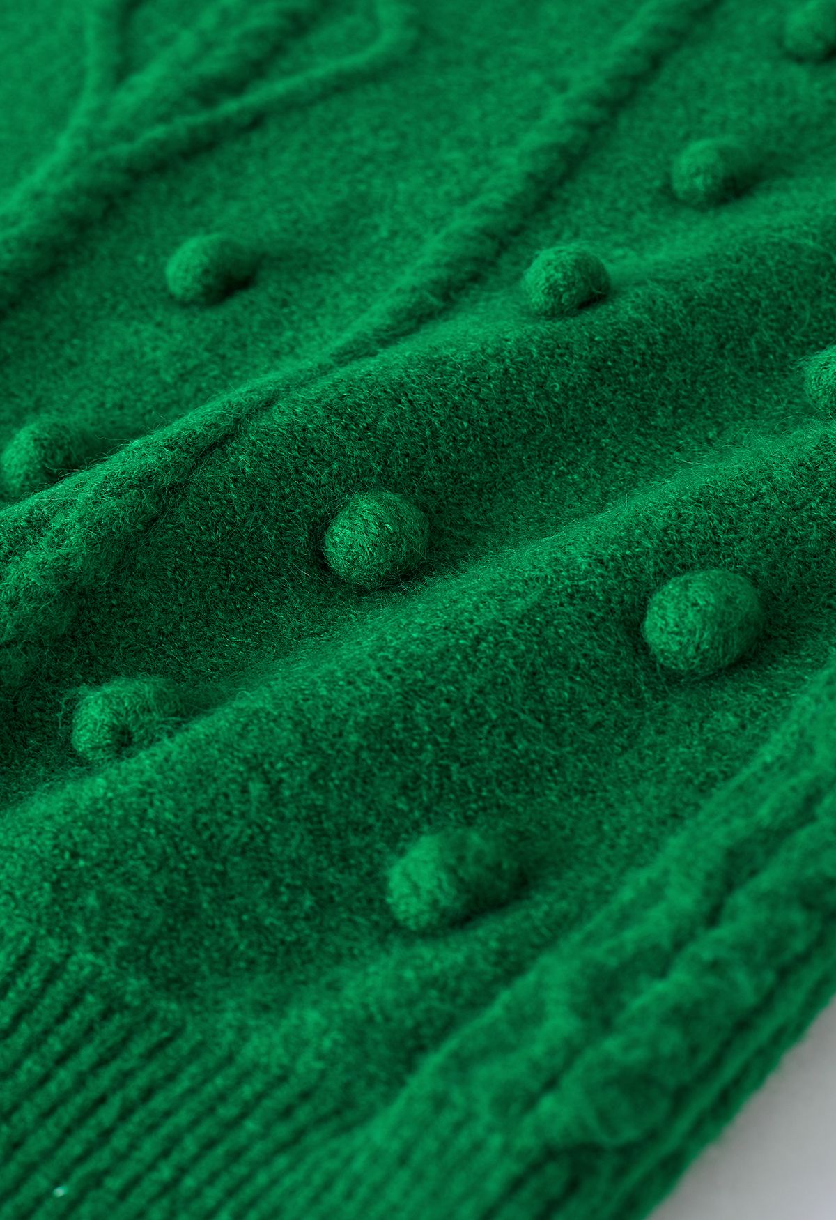 Zopfmuster-Pullover mit Pom-Pom-Besatz in Grün