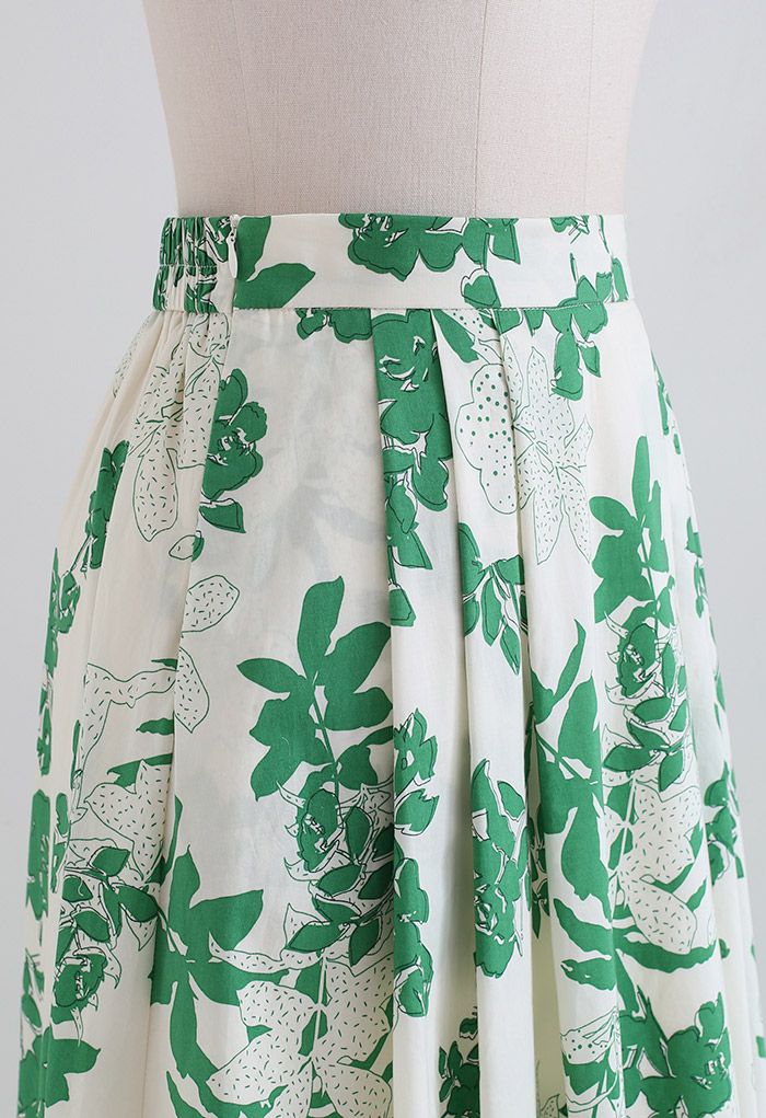 Grüner Baumwoll-Midirock mit Seitentaschen und Blumenmuster