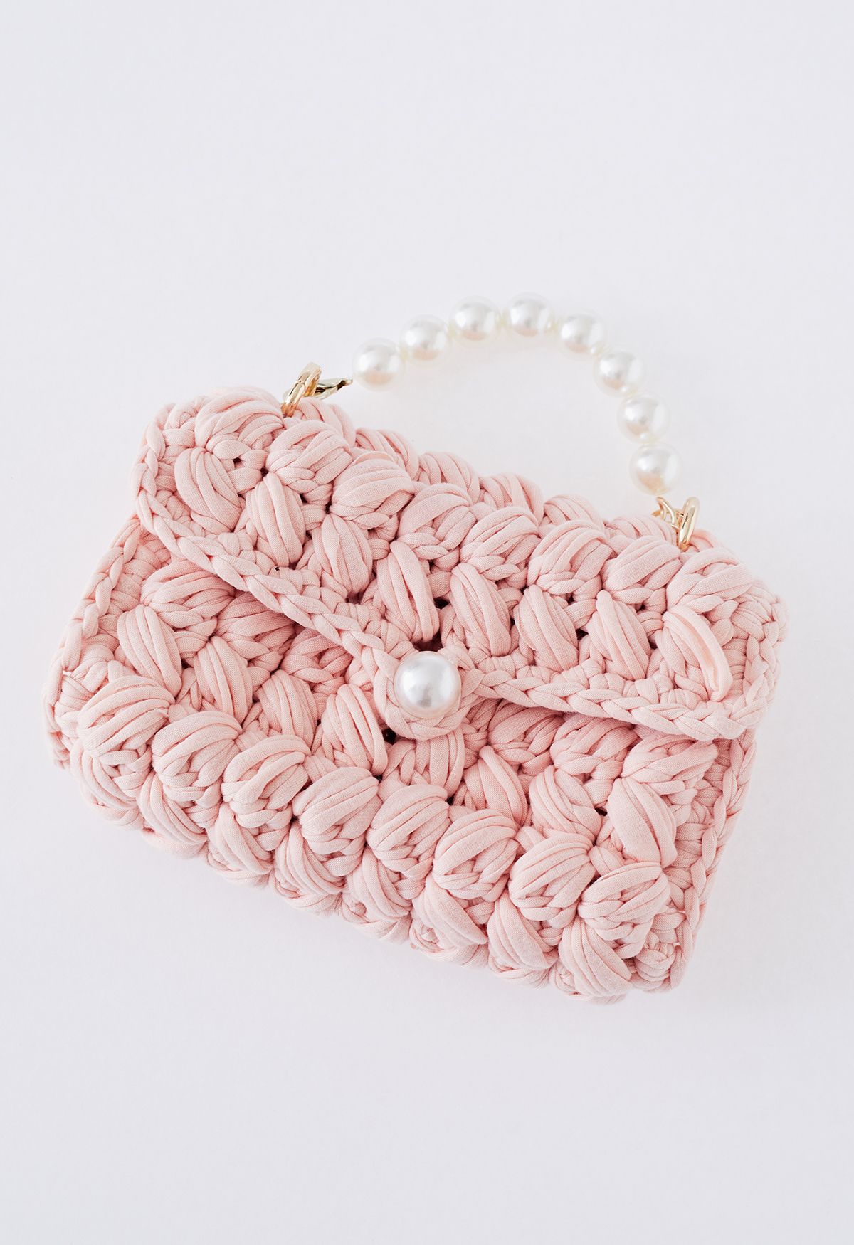Geflochtene Grobstrick-Minitasche mit Perlenkette in Rosa