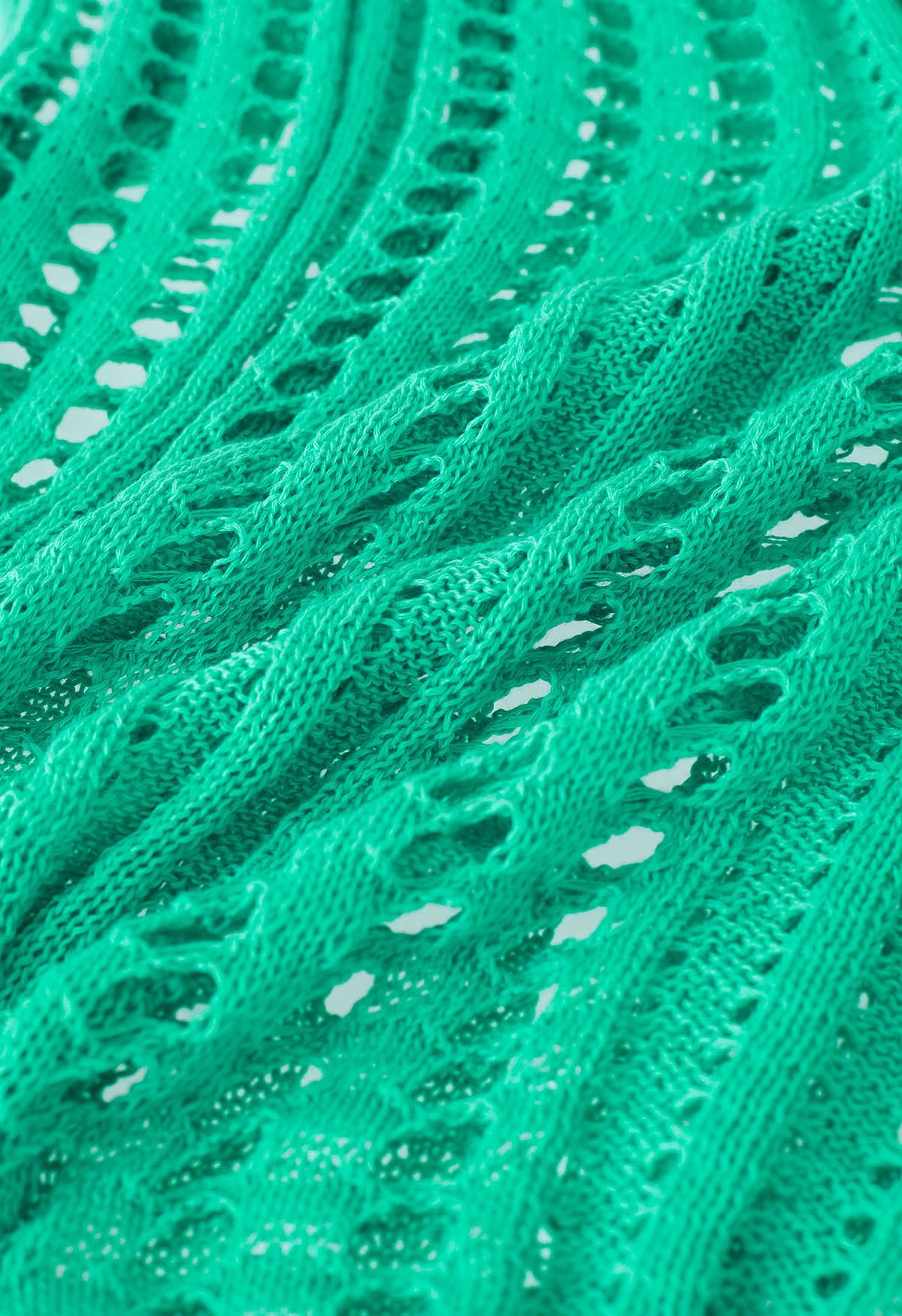 Durchbrochener Strick-Cover mit seitlichem Schlitz in Grün