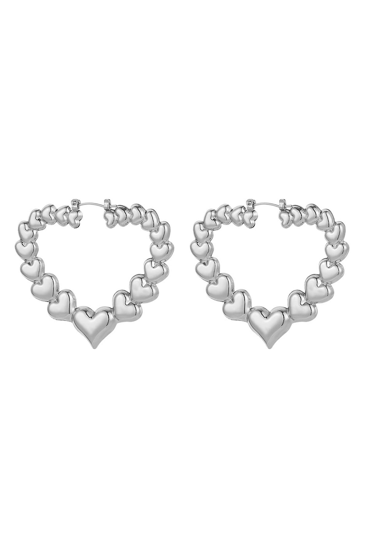 Ausgehöhlte Herz-Ohrringe aus Metall in Silber