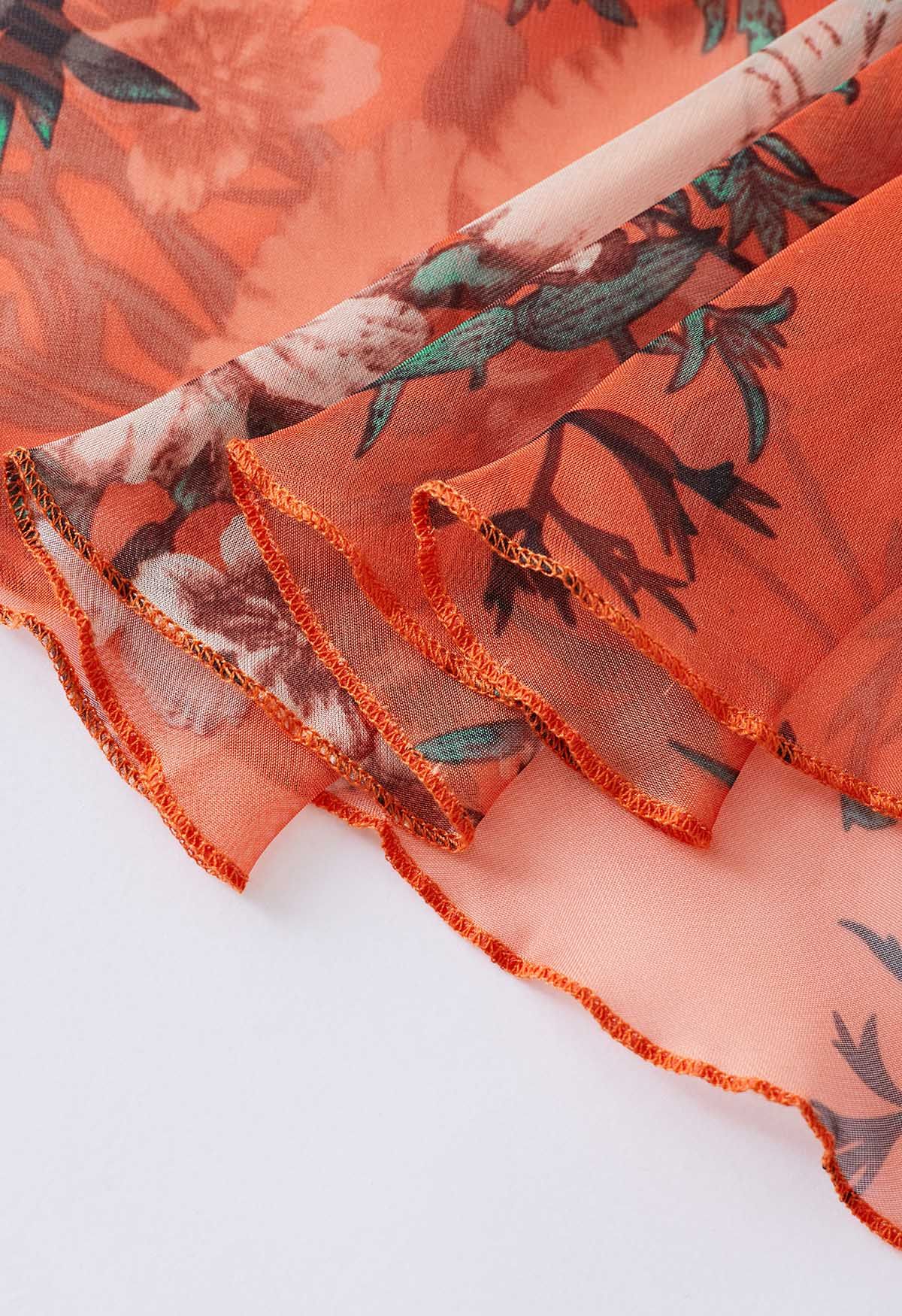 Orangefarbener Chiffon-Maxirock mit Blumenstrauß-Print