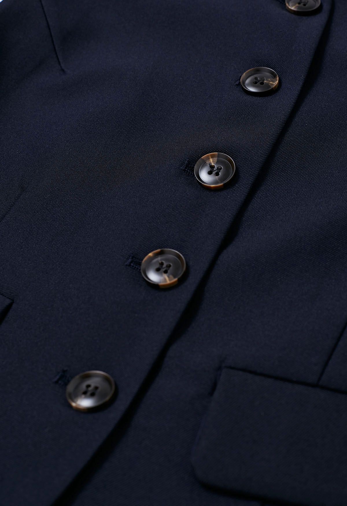 Set aus Weste mit Knopfleiste vorne und plissiertem Minirock in Marineblau