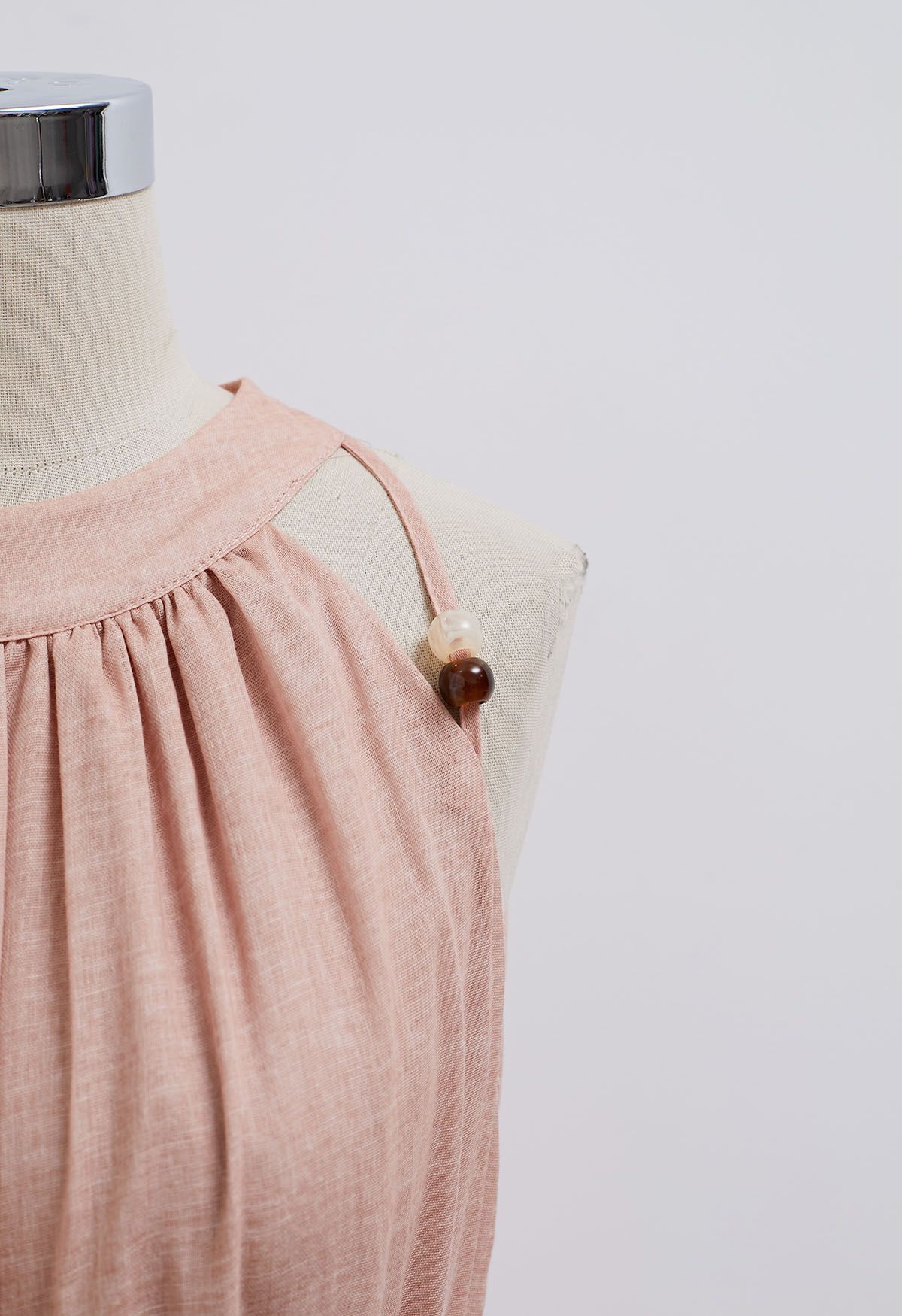 Neckholderkleid mit Perlenbesatz und Bindeband in Rosa