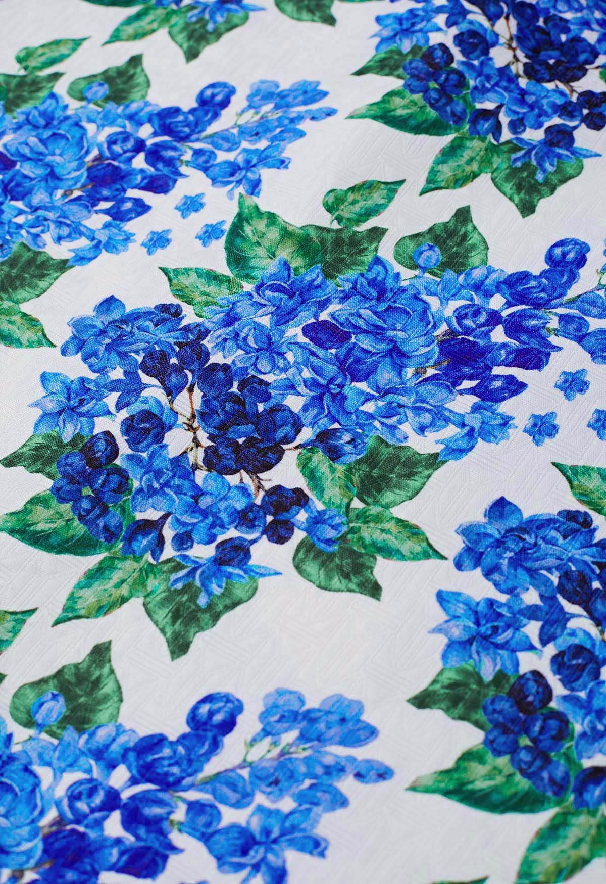 Blauer, plissierter Midirock mit Blumenmuster