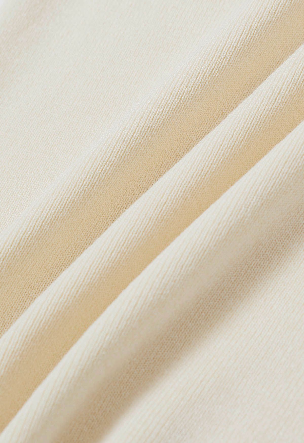 Perlenbesetztes One-Shoulder-Stricktop in Creme