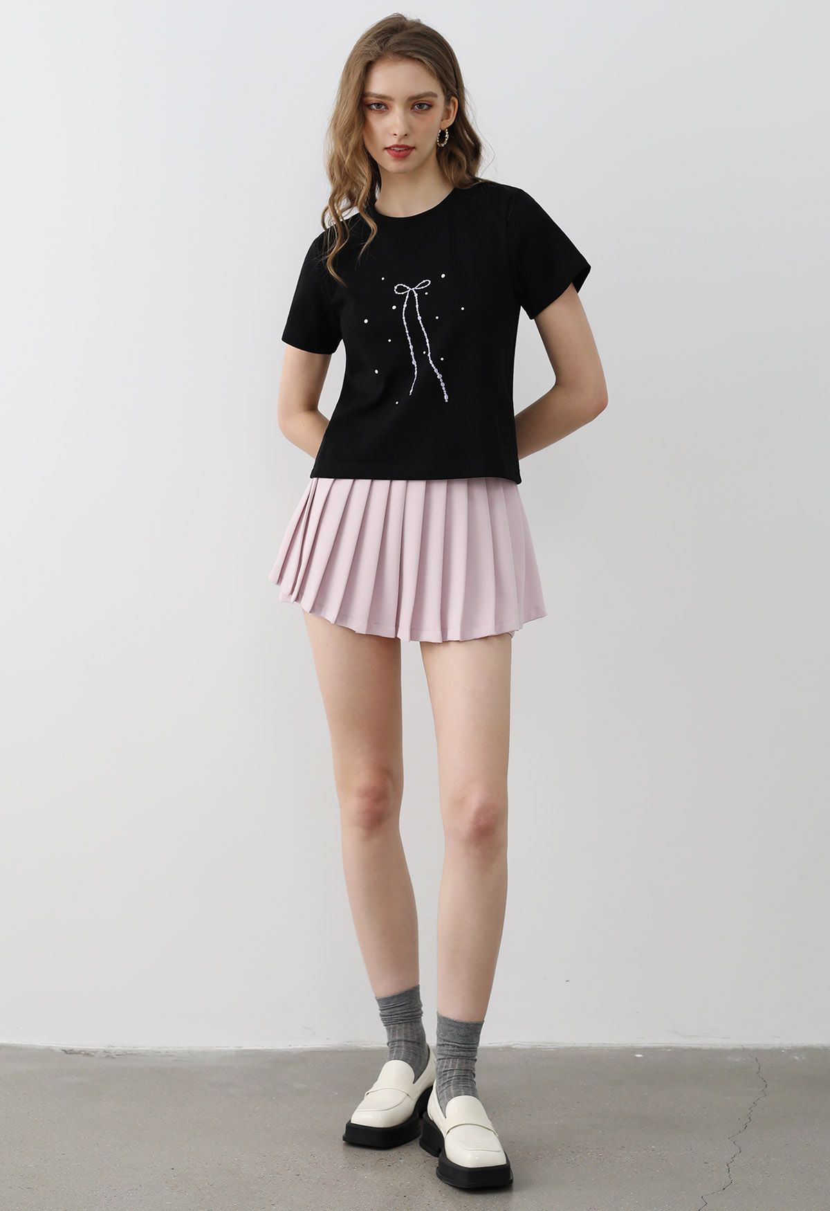 Plissierter Mini-Skort mit Schleife in Hellrosa