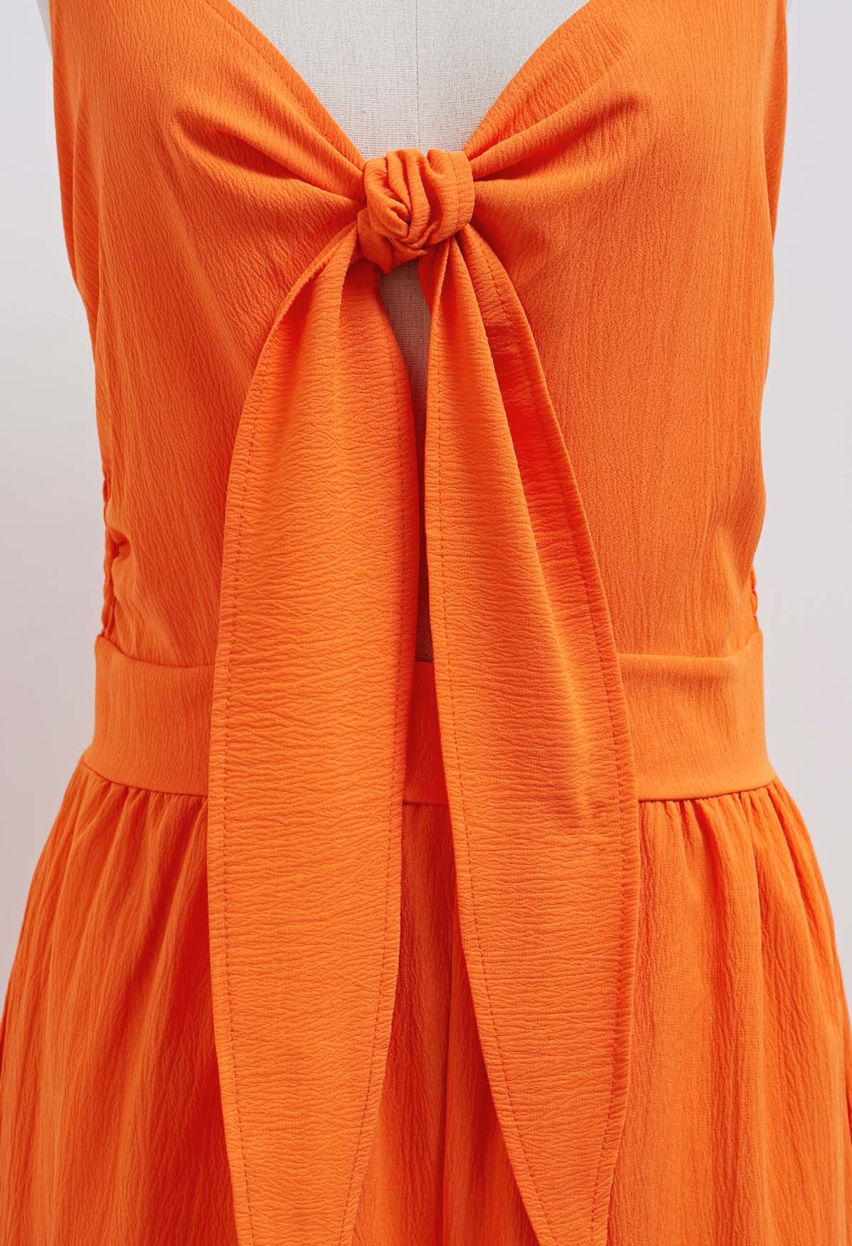 Jumpsuit mit Knoten vorne und Seitentaschen in Orange