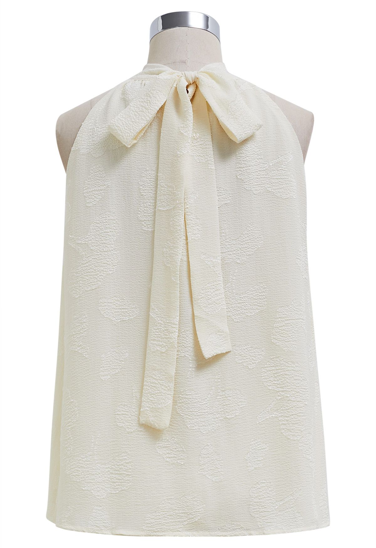 Neckholder-Top mit Schleife und Blumenprägung in Creme