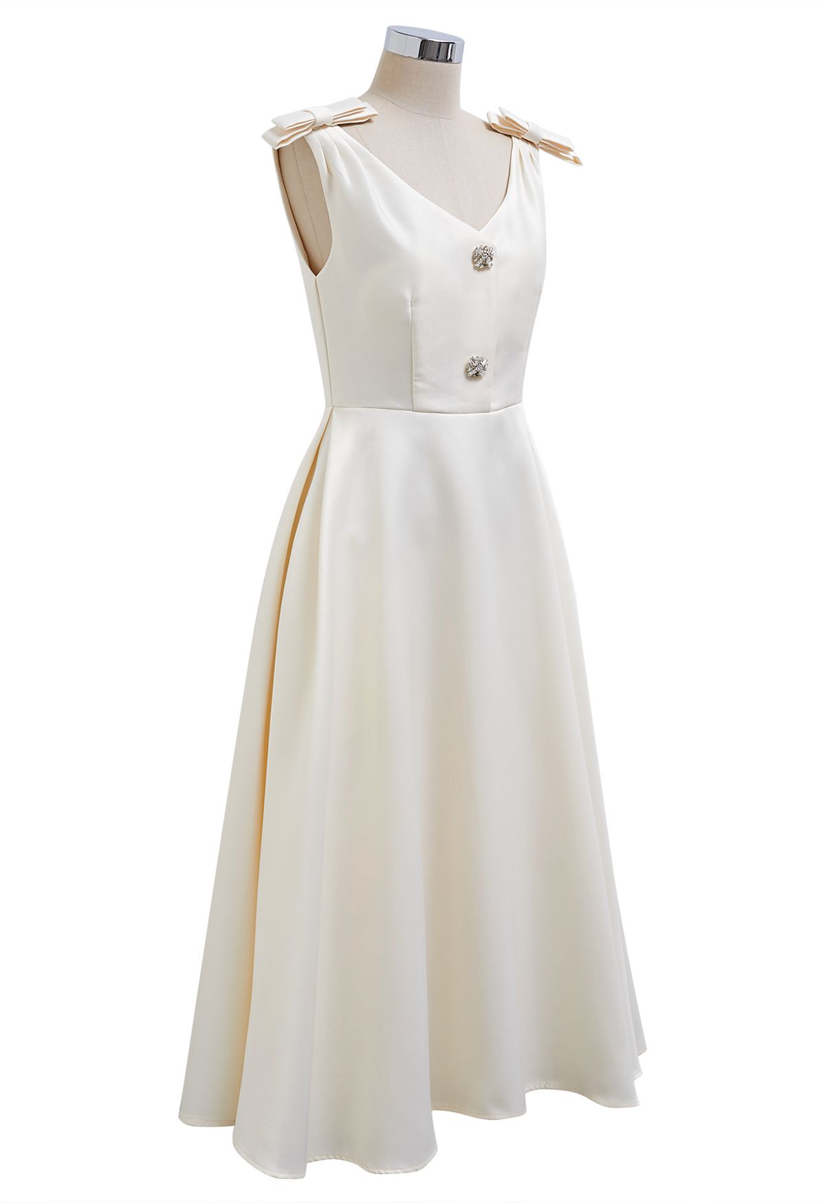 Midikleid mit Schleife an der Schulter und Zirkonia-Knöpfen in Creme