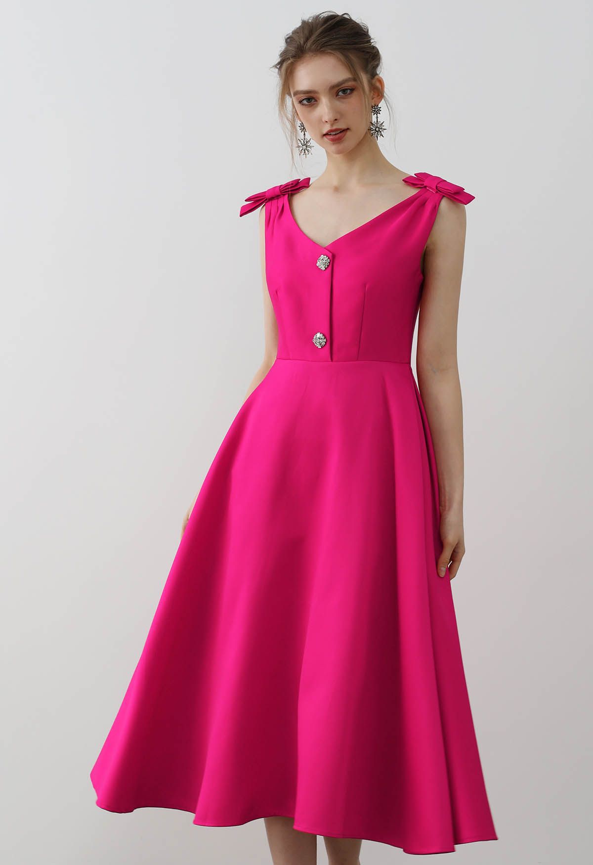 Midikleid mit Schleife an der Schulter und Zirkonia-Knöpfen in Magenta