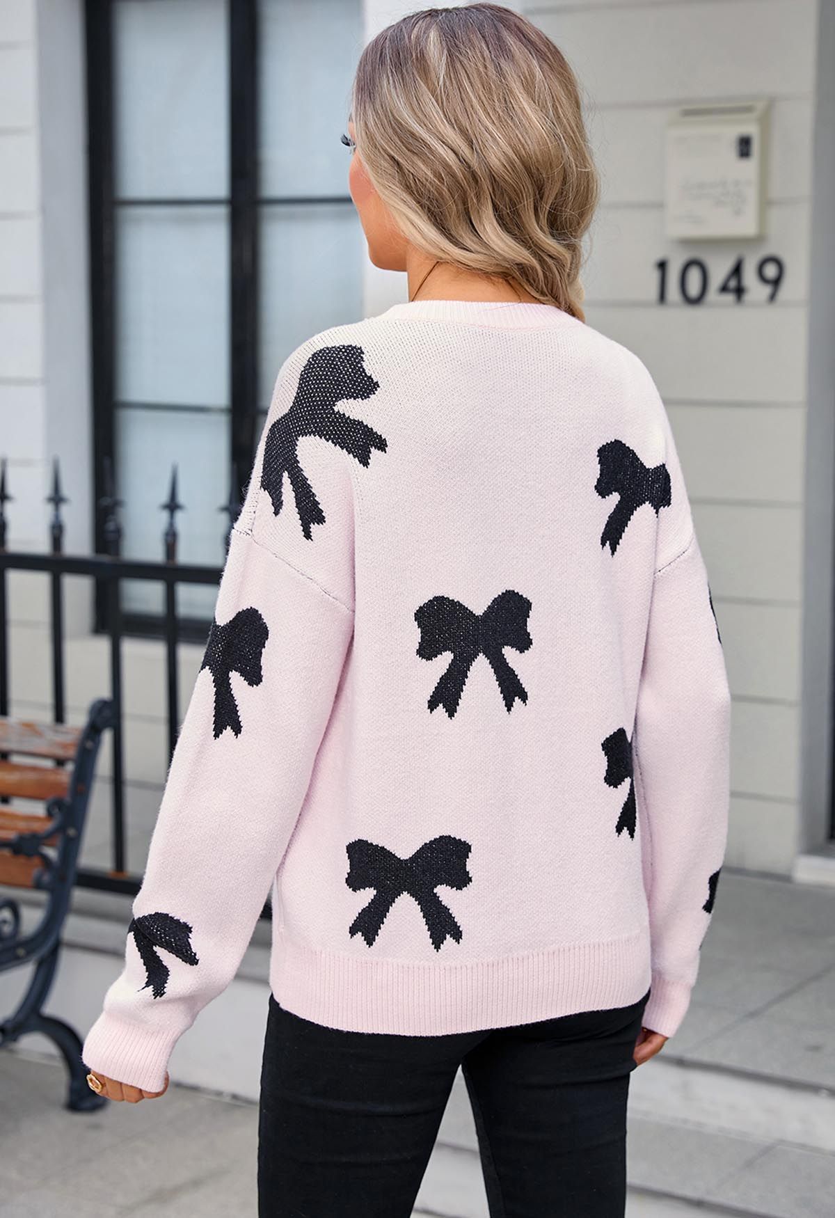 Schwarzer Jacquard-Strickpullover mit Cartoon-Schleife