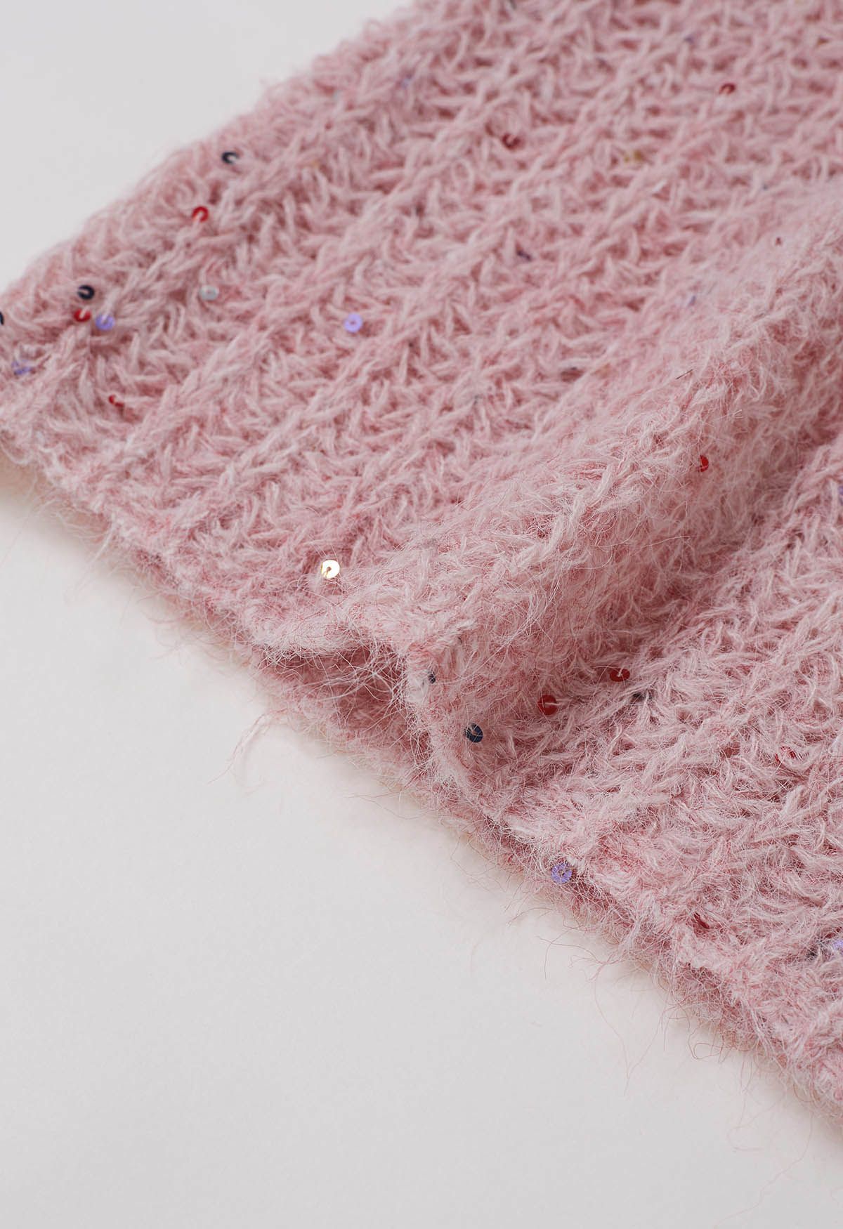 Gemütliche Strickjacke mit offener Vorderseite und bunten Pailletten in Pink