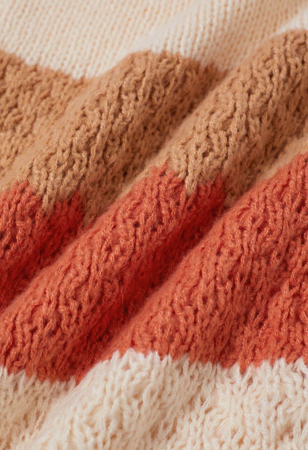 Strickjacke mit Puffärmeln und Farbblockdesign in warmen Farbtönen