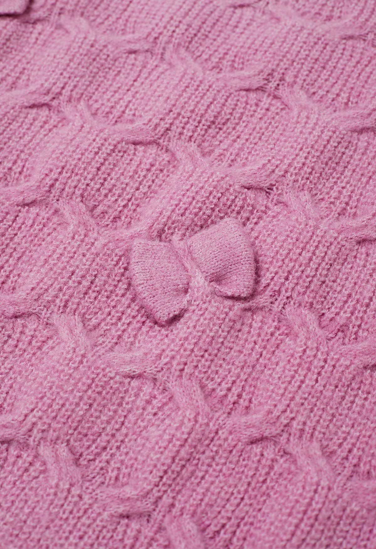 Verspielter Strickpullover mit geometrischer Schleife in Rosa