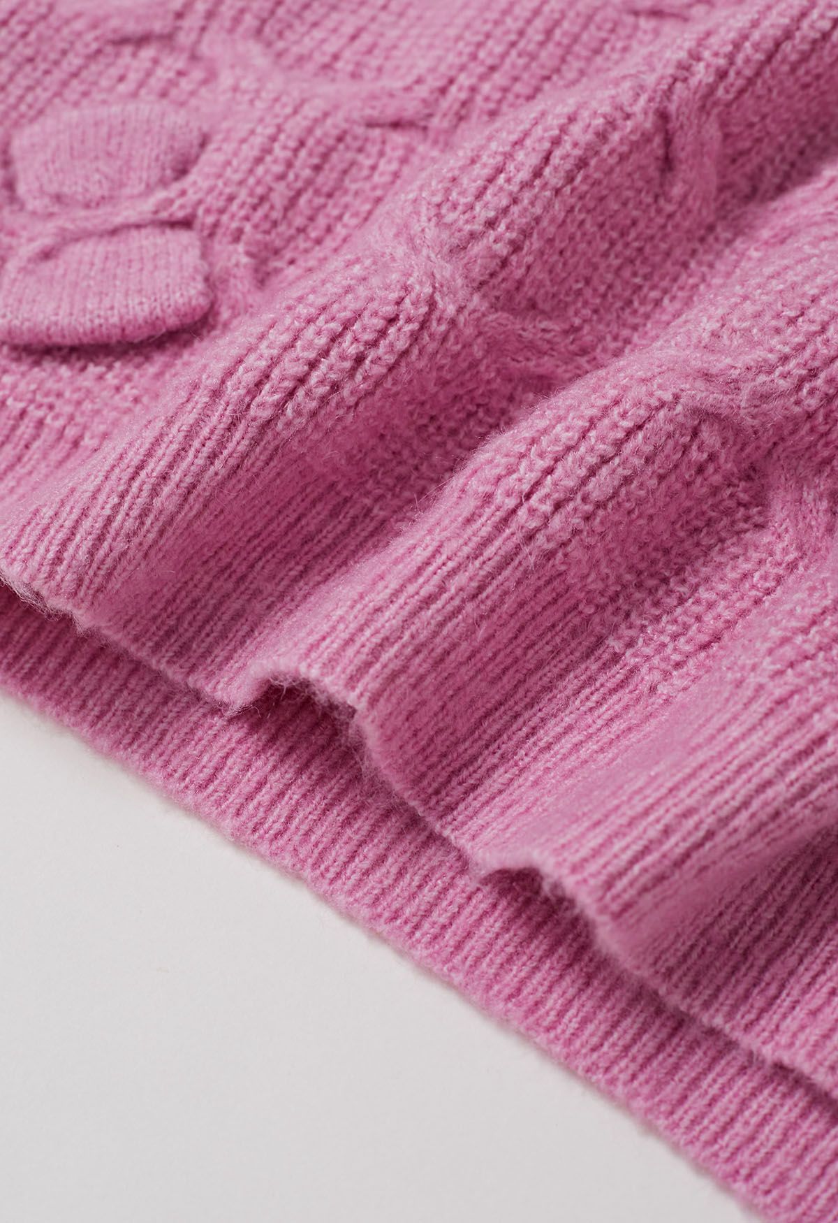 Verspielter Strickpullover mit geometrischer Schleife in Rosa