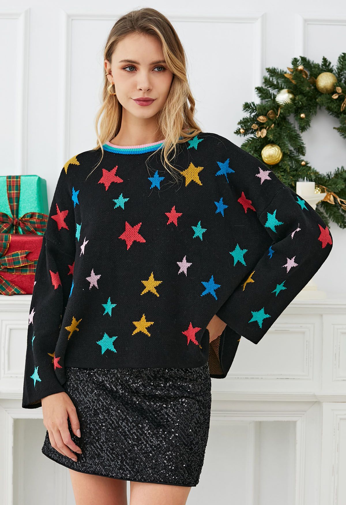 Cosmic Charm – Schwarzer Strickpullover mit Glockenärmeln und Sternen