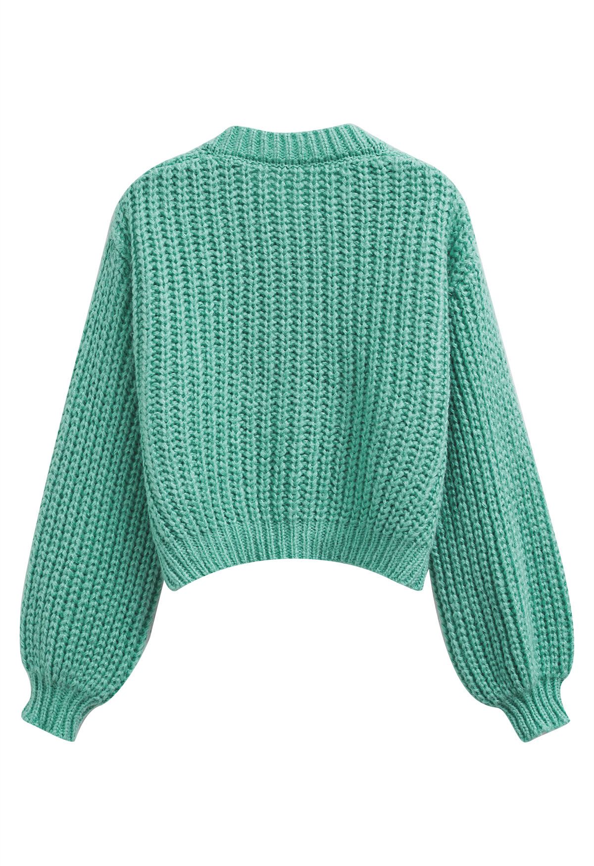 Kurze Strickjacke aus grobem Strick mit Puffärmeln und Knöpfen in Türkis