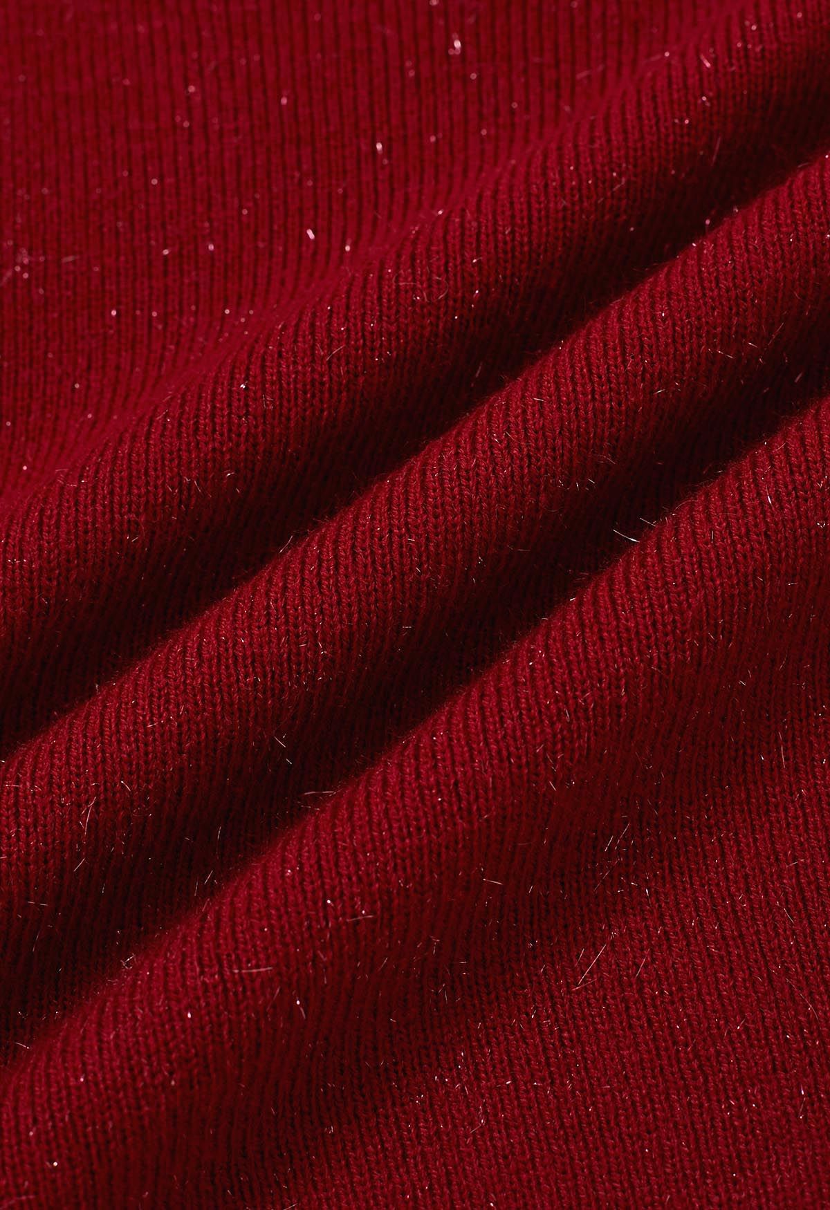 Zierliches Stricktop mit Spitzenmanschetten und Schleife in Rot