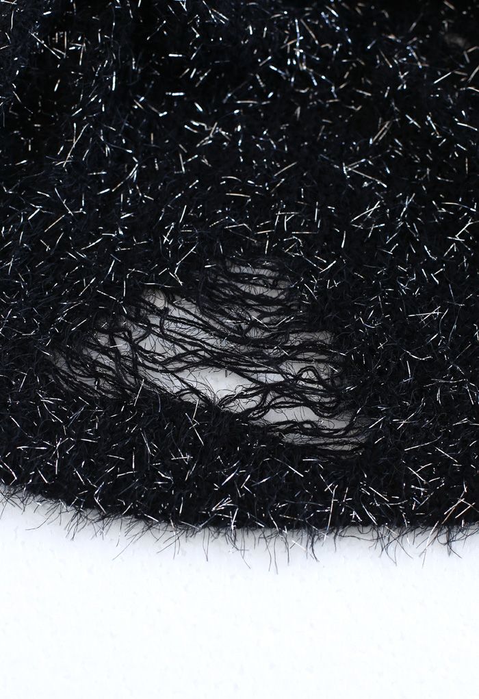 Suéter corto y esponjoso espumoso en negro