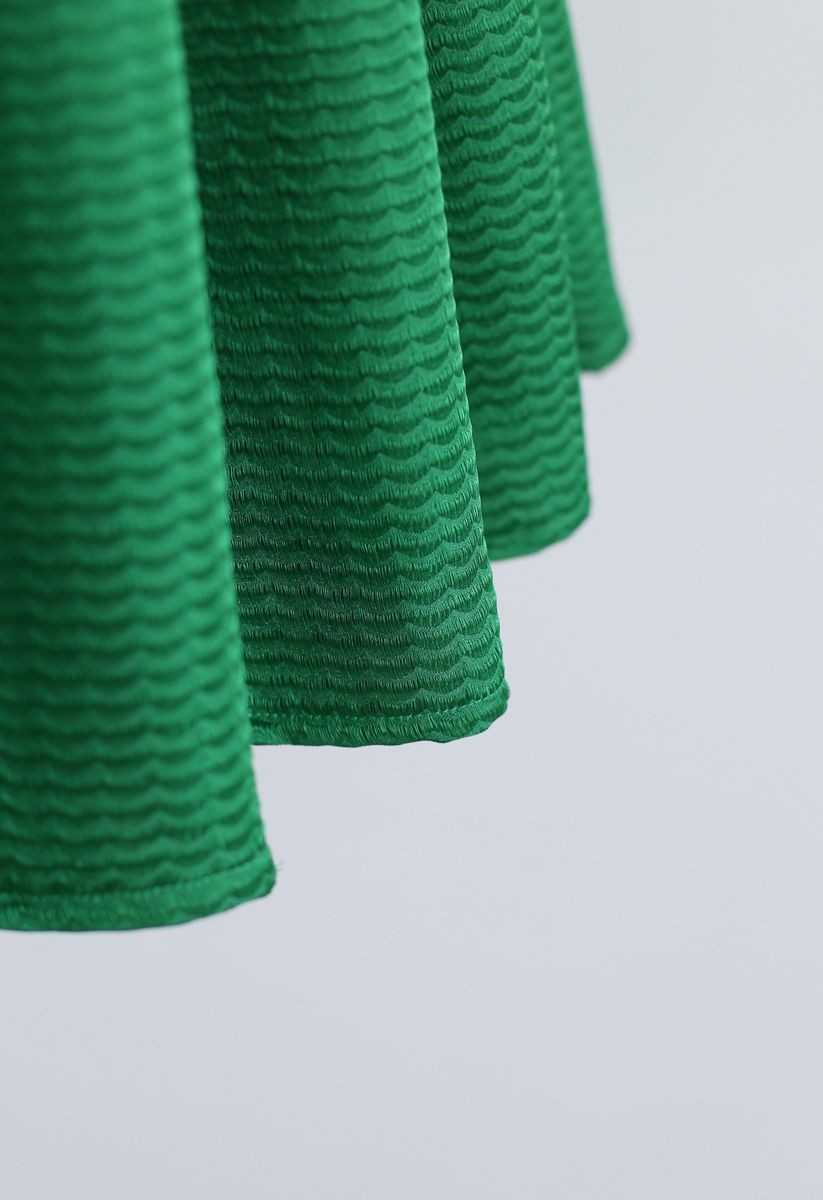 Gewellter, plissierter Midirock in Grün
