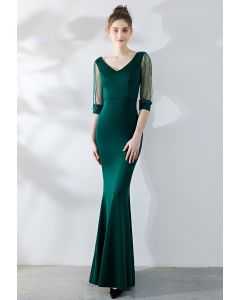Kleid mit drapierten Netzärmeln in Smaragdgrün