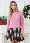 Verspielter Strickpullover mit geometrischer Schleife in Rosa