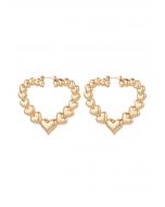 Ausgehöhlte Herz-Ohrringe aus Metall in Gold