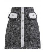 Geknöpfter Minirock aus Tweed mit Fransenbesatz