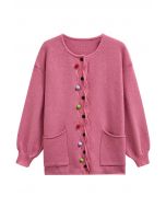 Farbenfrohe, gewellte Strickjacke mit aufgesetzten Taschen und Pom-Pom-Knöpfen in Pink