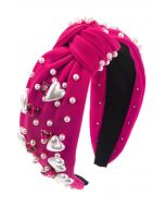 Geknotetes Stirnband mit Herz-Strass-Perlen in Magenta